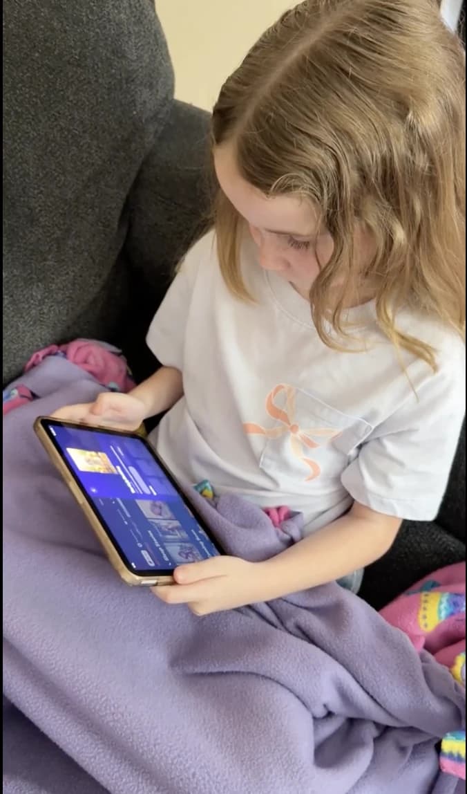A child watching GoodWatch on a tablet
